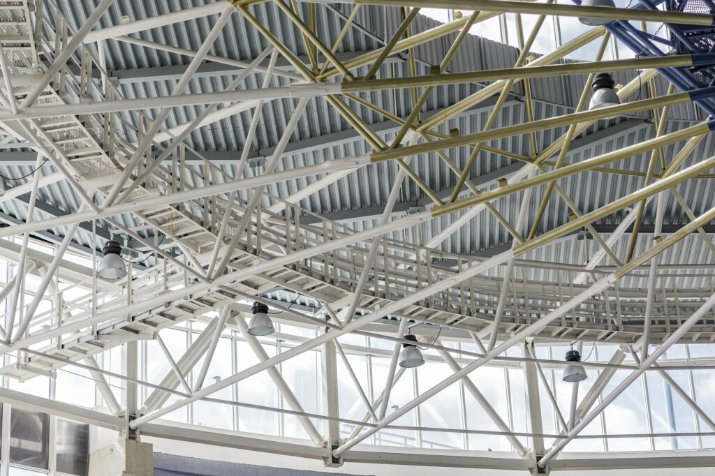 Metal tubes ceiling in big office building